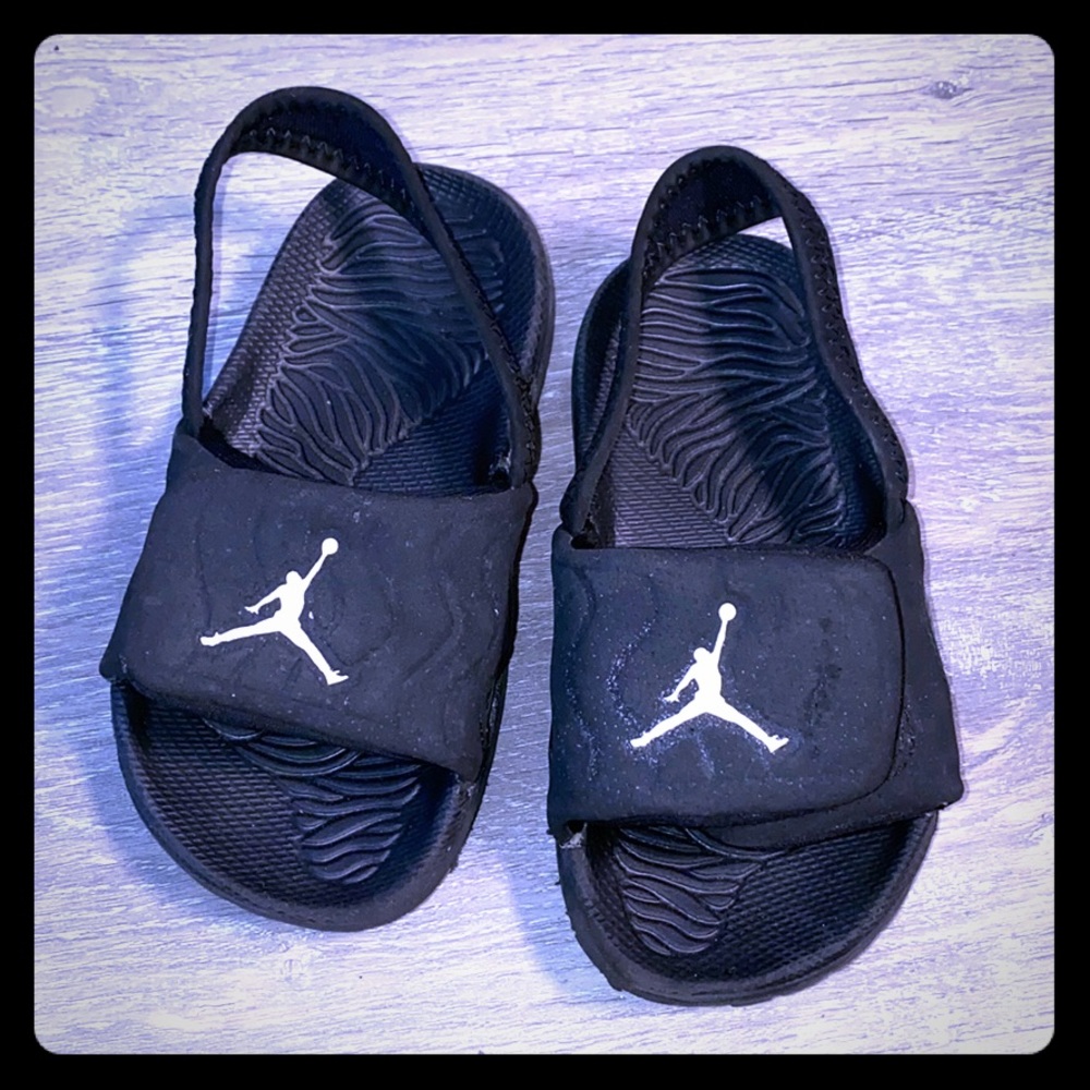 Kids Jordan slides black with white Jordan sign